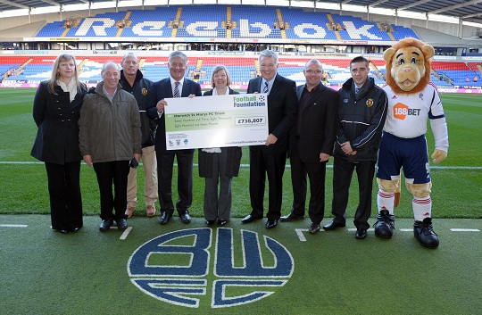 Horwich St Mary's receive their Football Foundation cheque from FA Chairman David Bernstein at the Reebok Arena